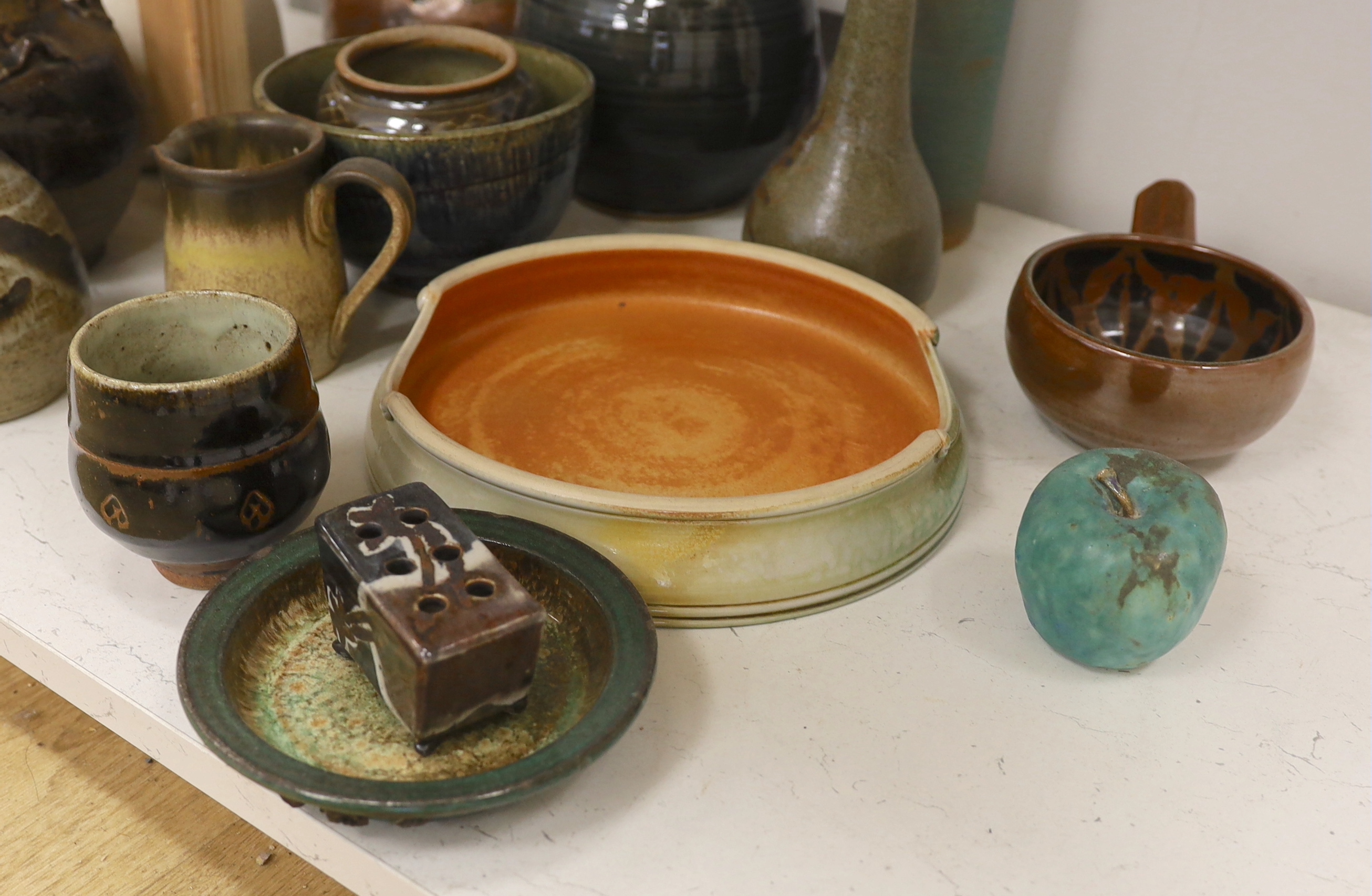 A large collection of mixed studio pottery vases, bowls and dishes